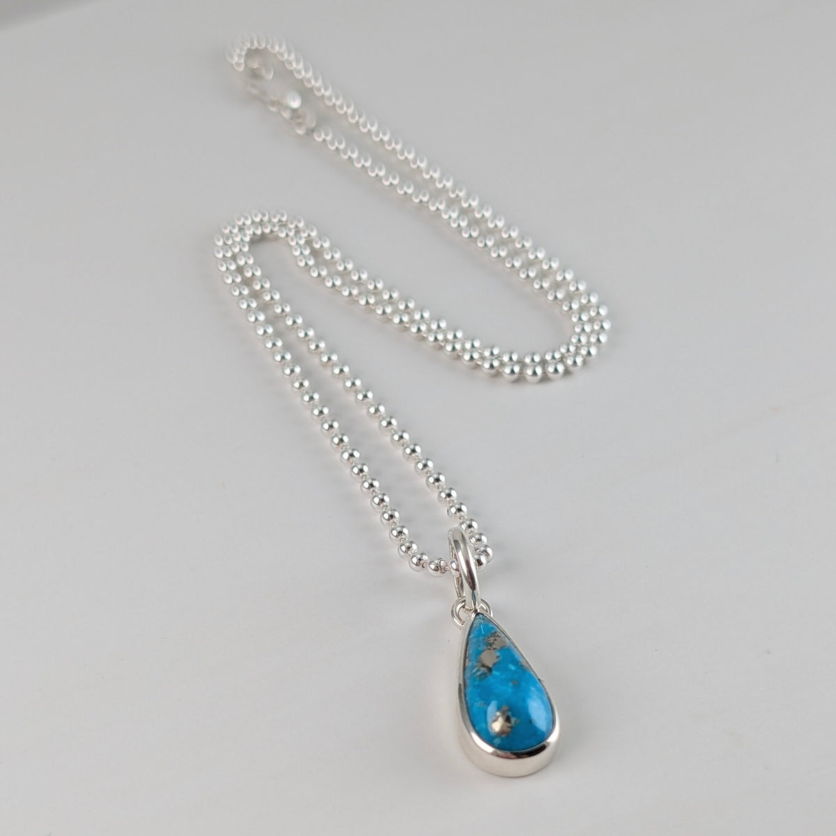 Ball chain necklace with small teardrop Persian turquoise pendant