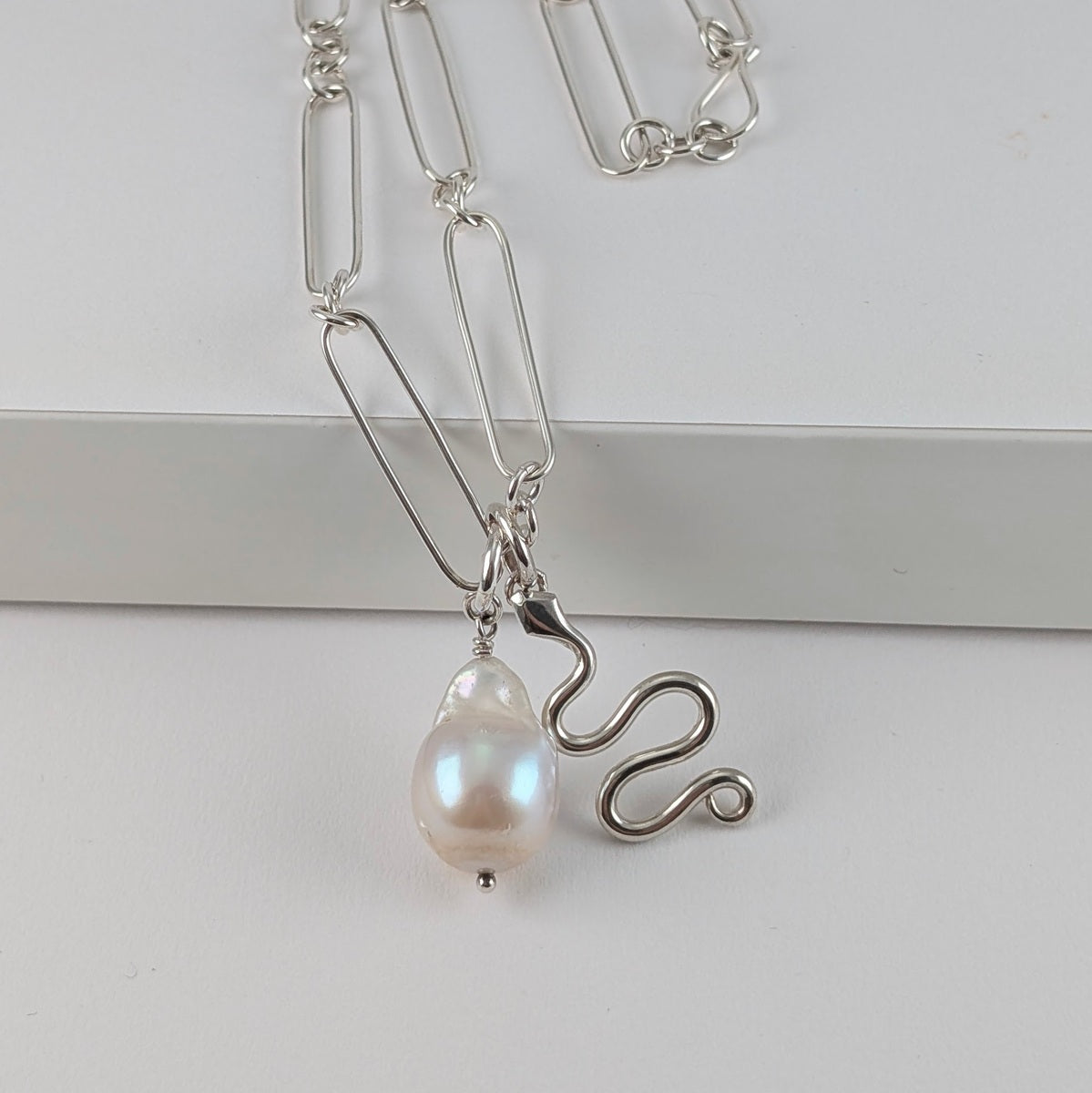Mixed long paper chain necklace with snake and  large baroque pearl pendants