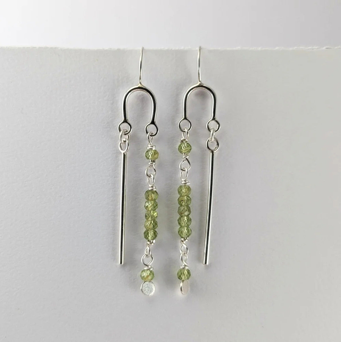 Long U drop peridot earrings
