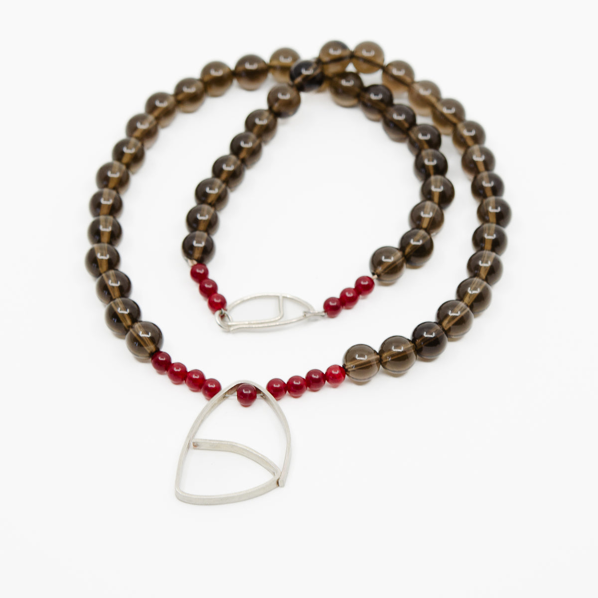Gemstone  necklace with silver pendant.