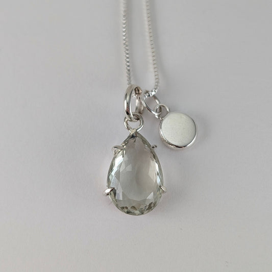 Teardrop shaped facet cut prasiolite pendant, hammered nugget pendant on a box chain necklace
