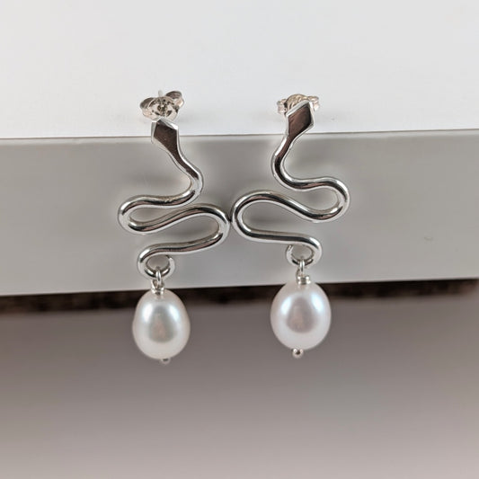 Large snake stud earrings with white baroque pearls